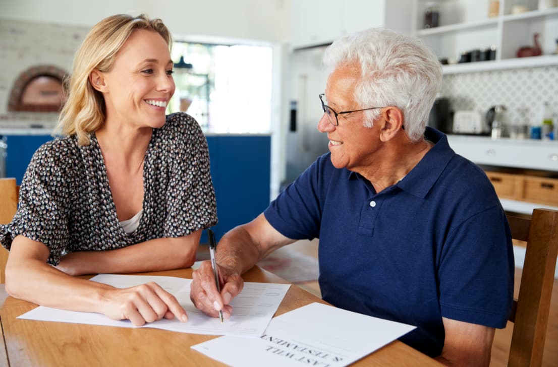 a lady helping her Dad organise his will